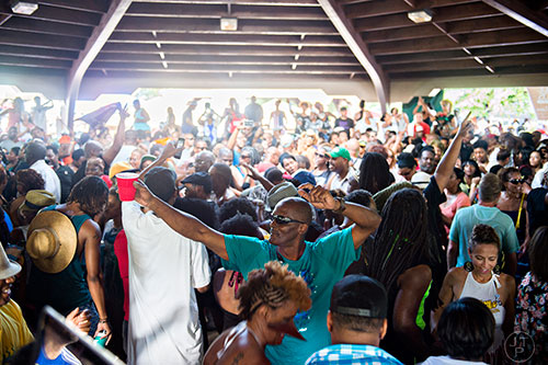 Photo: Jonathan Phillips Darryle Clarke (center) dances amidst the throngs of people during House at the Park at Grant Park in Atlanta on Sunday, September 6, 2015.